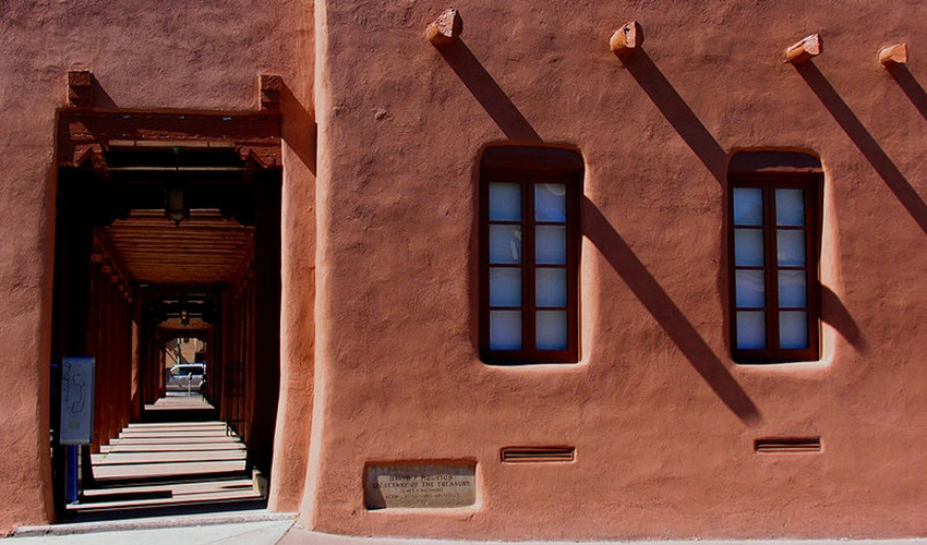 photo of exterior of adobe style building